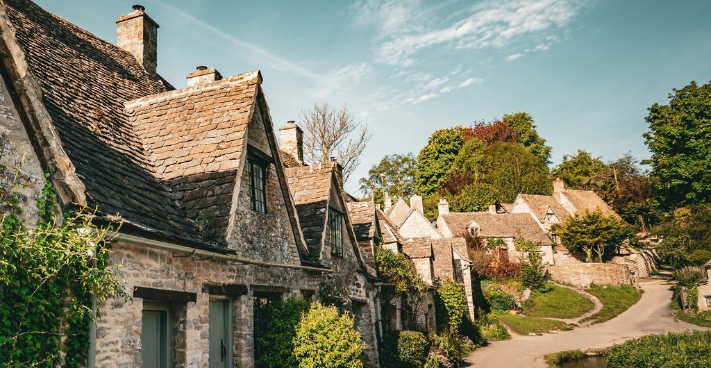 Rij oude stenen huisjes van Arlington Row in Bibury in de Cotswolds